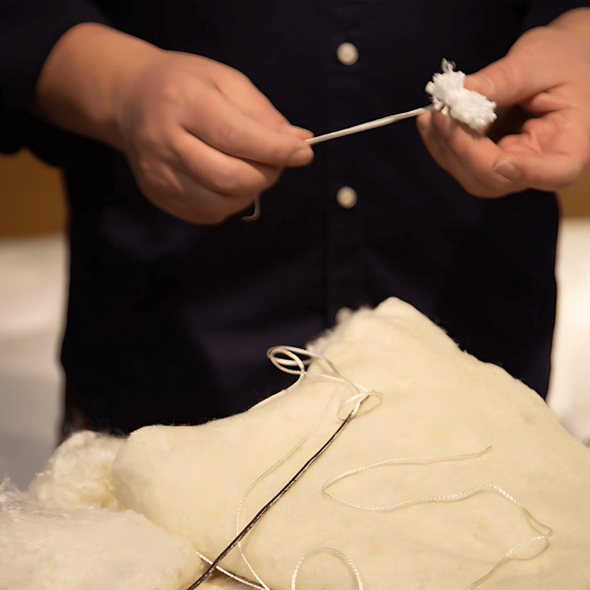 Artisan crafting the English Royal Mattress with natural fillers and traditional methods.