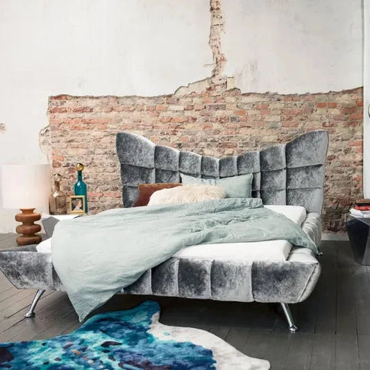 Cloud 7 Bed BRETZ with luxurious mattress and handcrafted three-dimensional cassette design against an exposed brick wall.