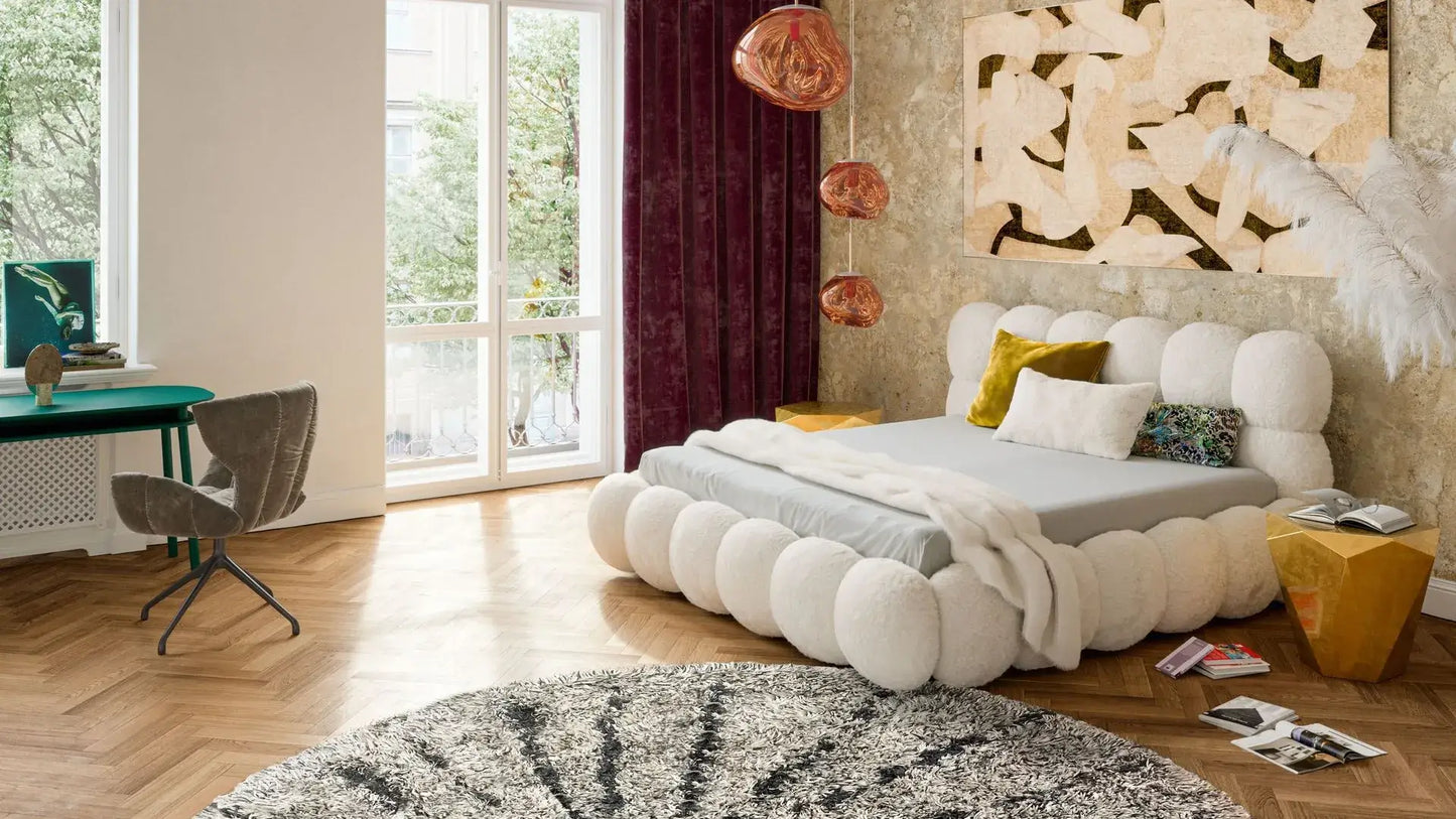 Balaao luxury bed with round upholstered elements in a stylish bedroom setting.